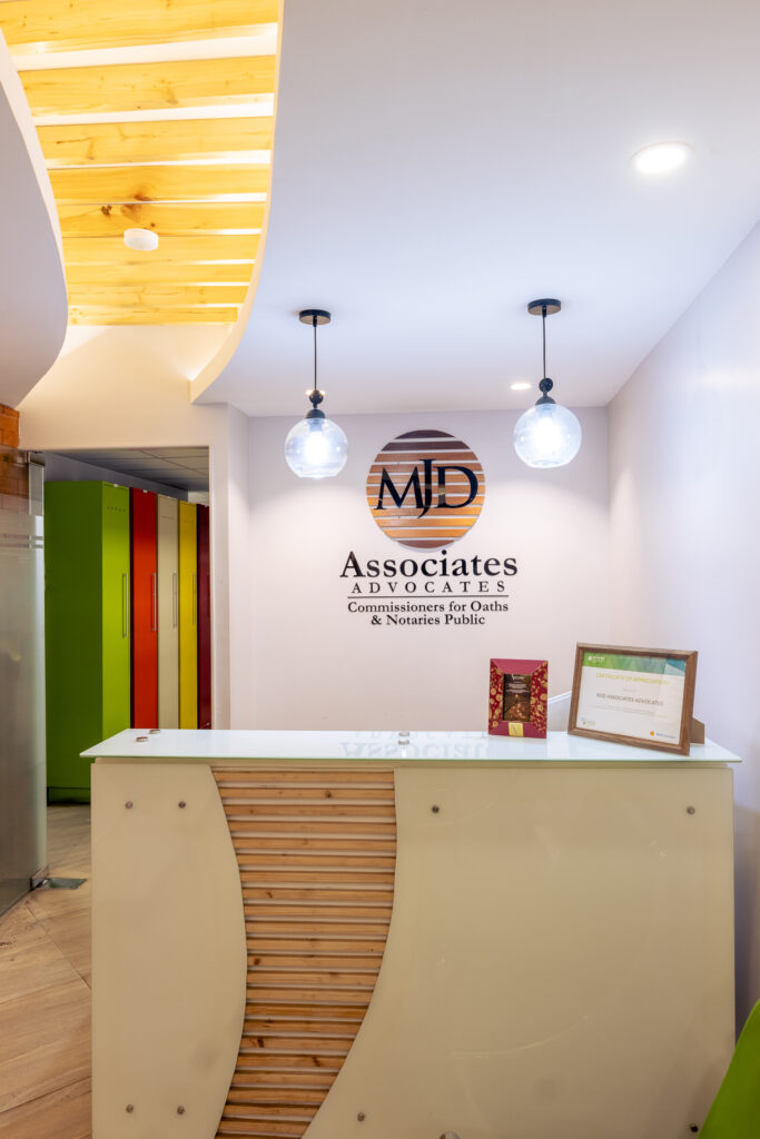 MJD Office Reception Desk with Large MJD Logo.